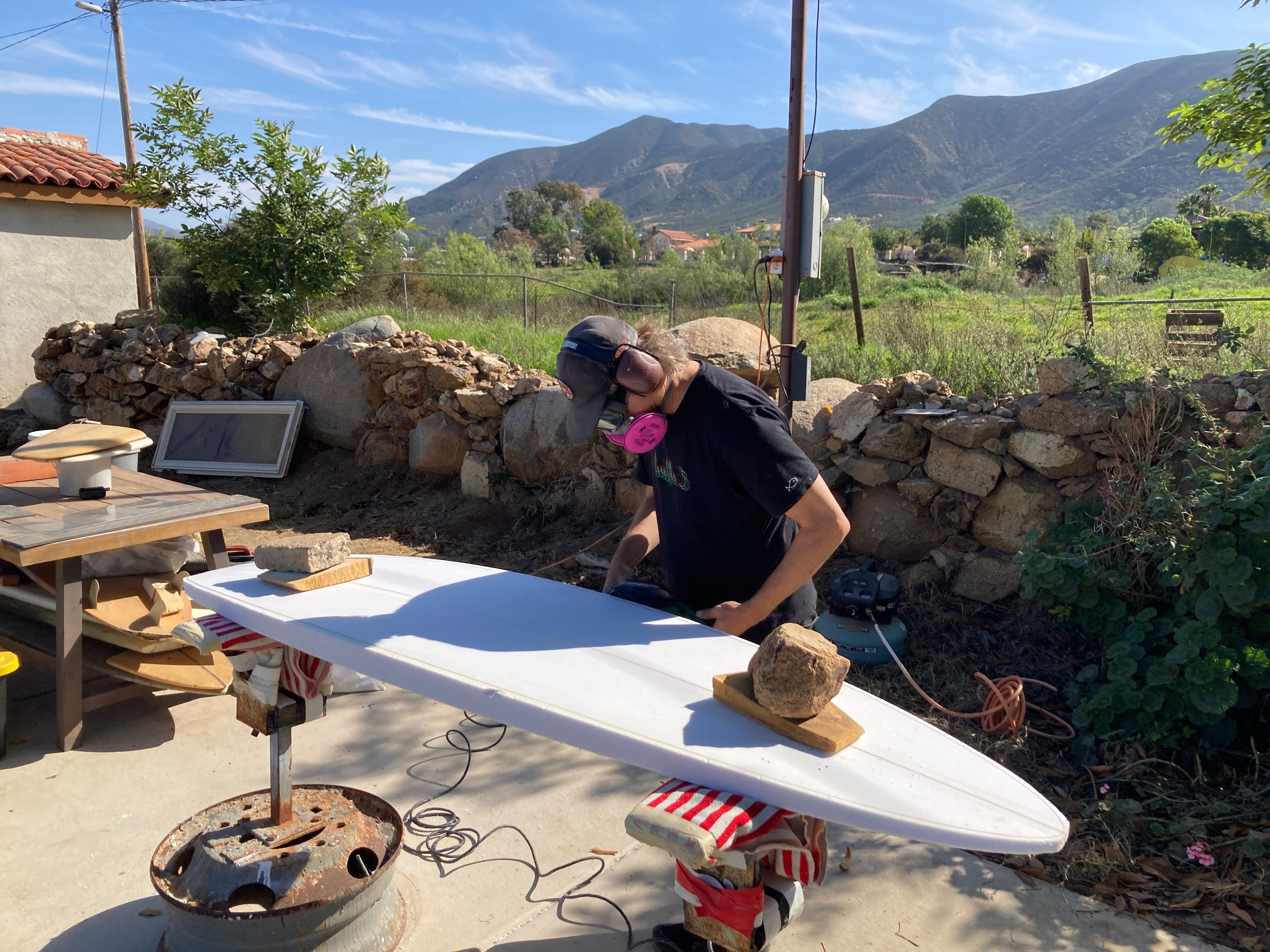 Matt Lamkin shaping a surfboard