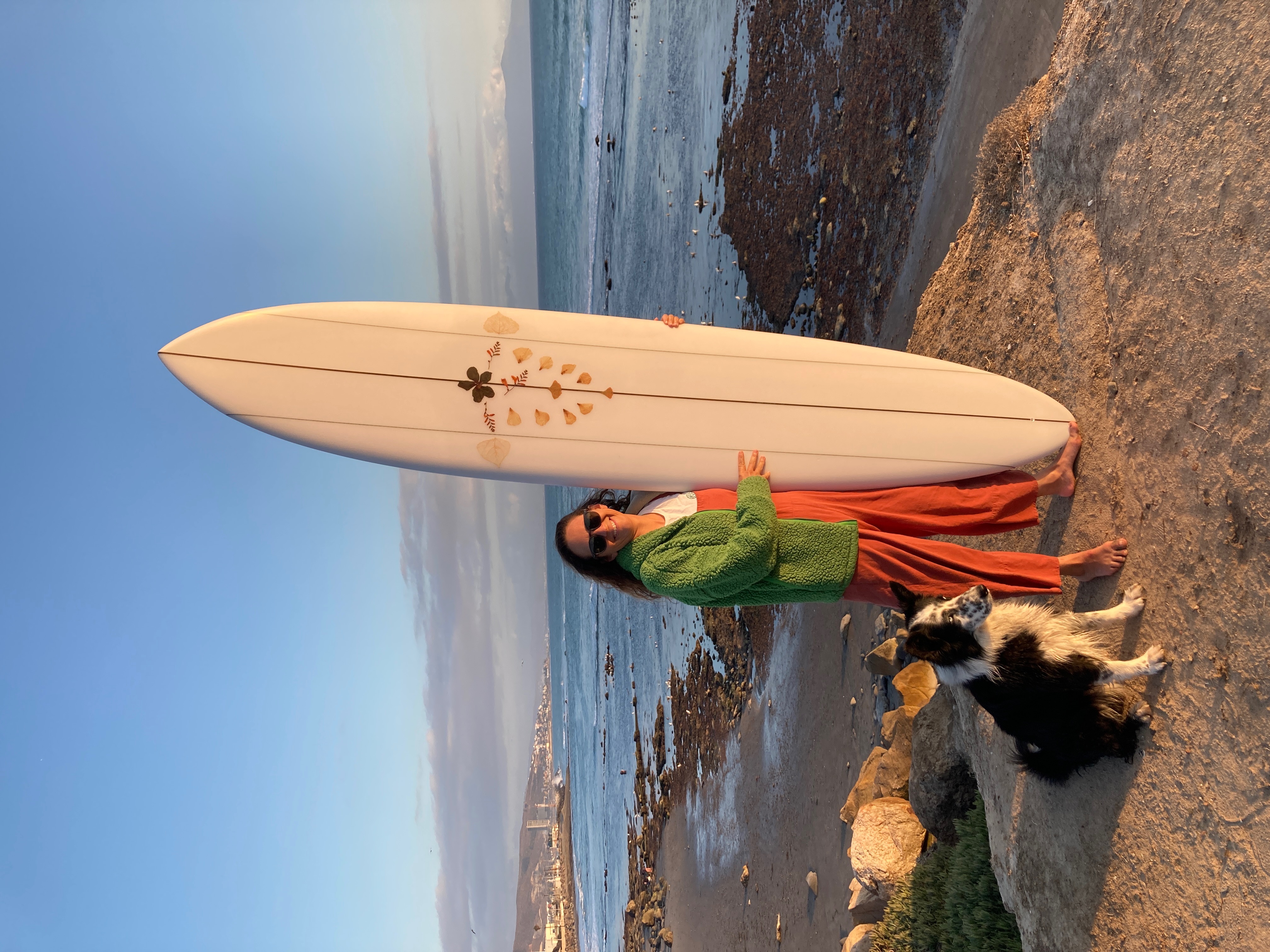 A woman happy with her surfboard